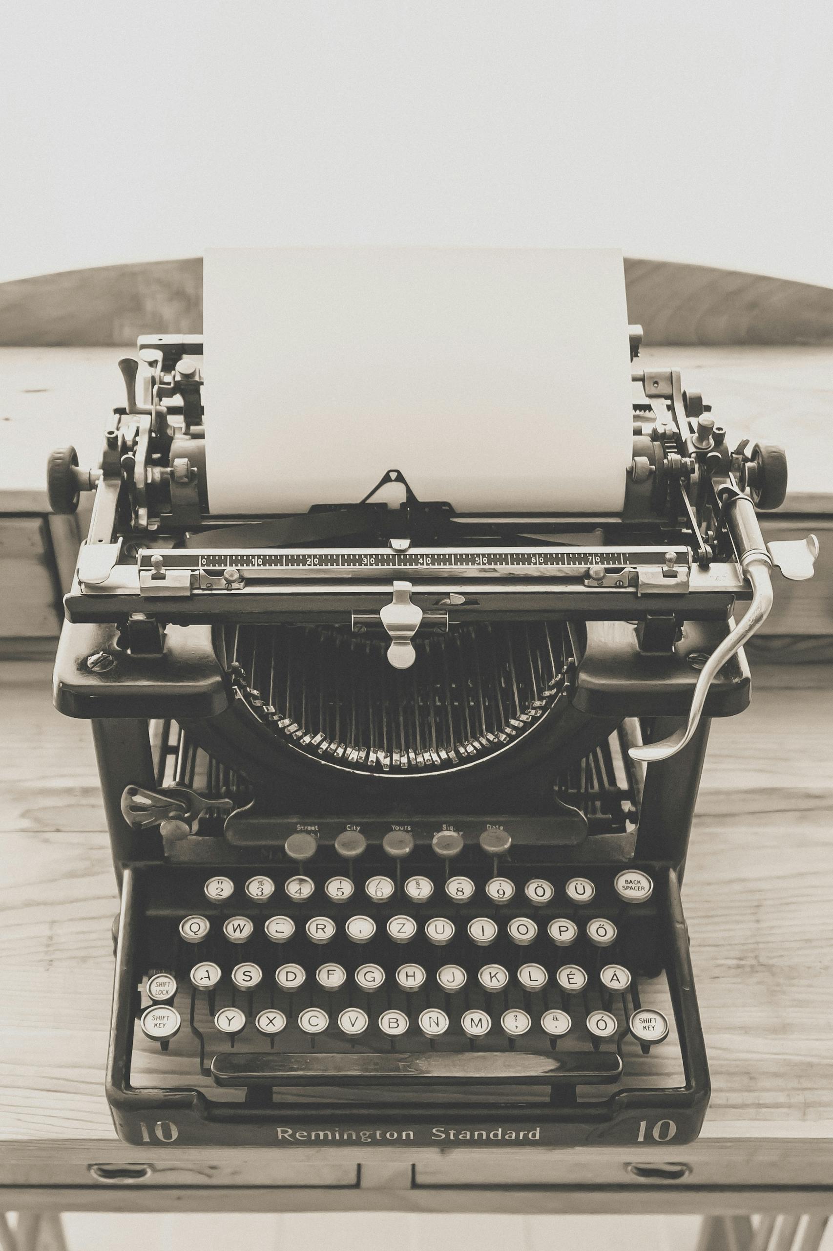 Classic Remington Standard typewriter on a wooden desk, evoking a sense of nostalgia and vintage charm.